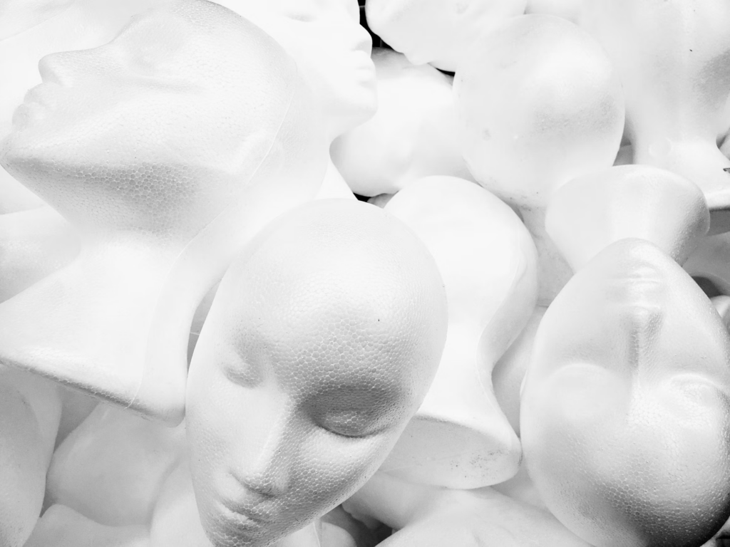 A big pile of styrofoam mannequin heads.