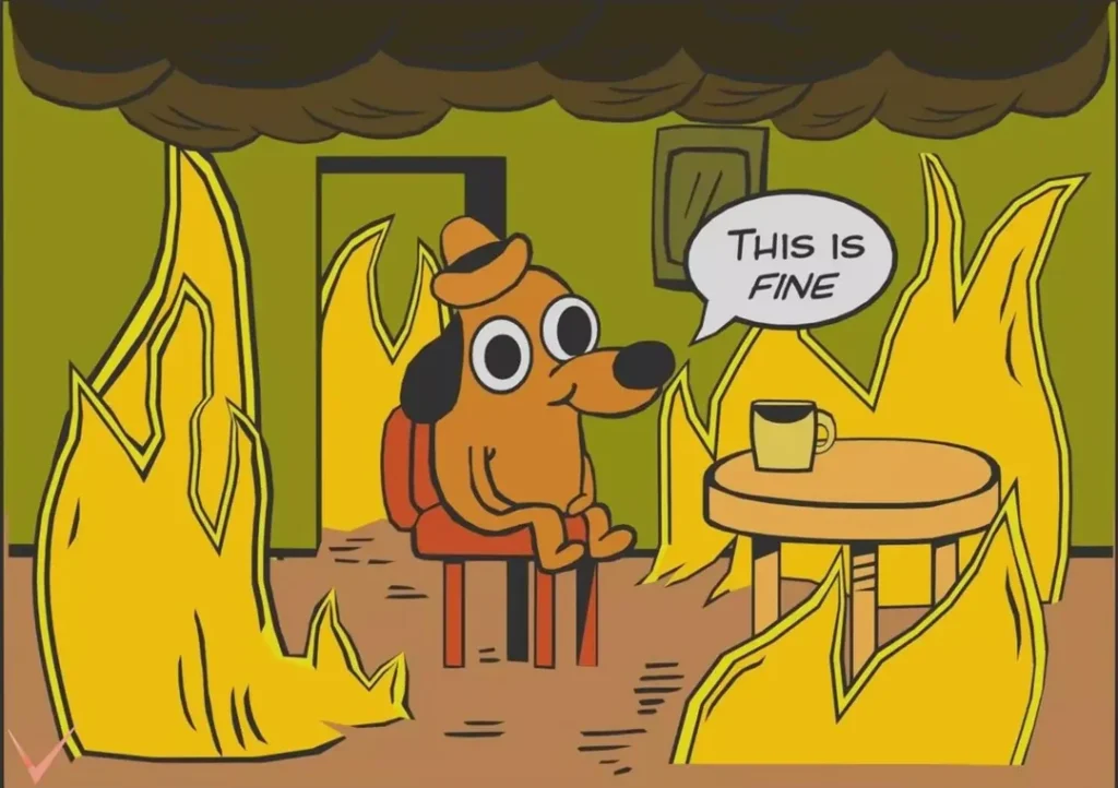 The "This is Fine" meme, which depicts a cartoon dog sitting at a table drinking coffee while the room is on fire.